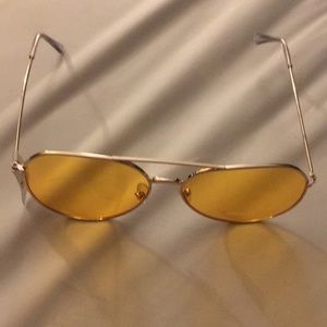 Aviator sunglasses. Yellow tint.